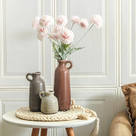 Three-piece vase set enhances tabletops, shelves, and dining tables.