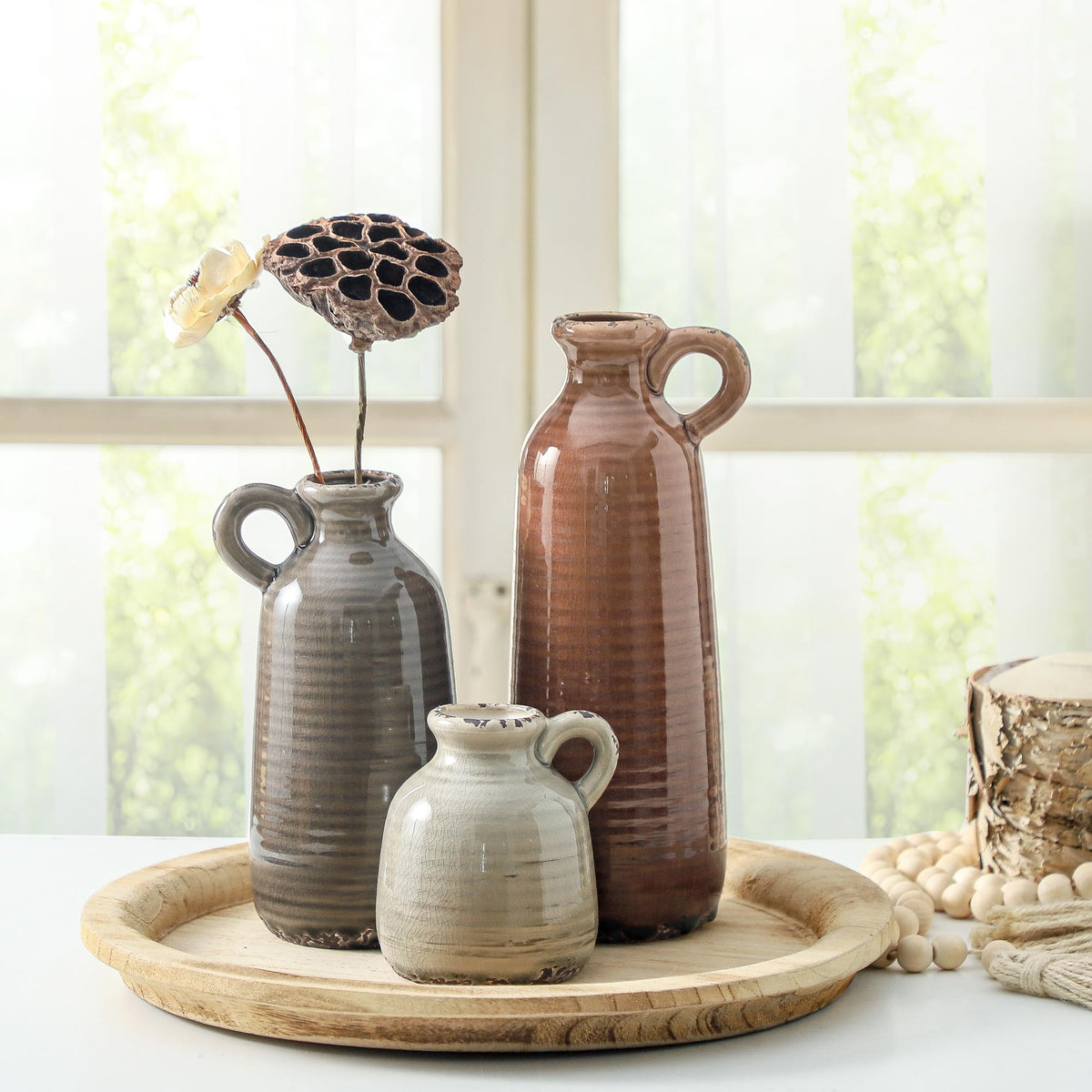 Vases positioned on tables elevate entryways, shelves, and mantels.
