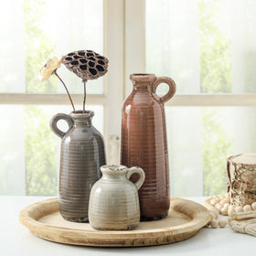 Vases positioned on tables elevate entryways, shelves, and mantels.