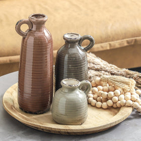 Neutral brown glaze pairs with greenery and natural materials.