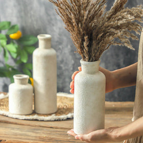 OOIT whitewashed vases add elegance to entryways and mantels.