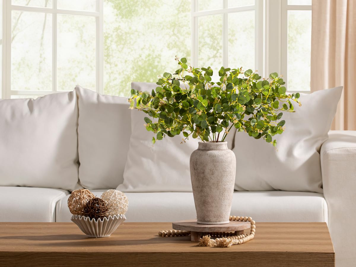 OOIT hand-painted ceramic vase adds unique texture and artisan charm.