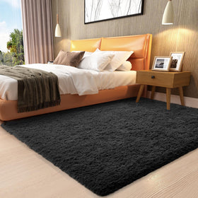 Ophanie 3x5 black rug in dorm room with cozy plush texture for student comfort
