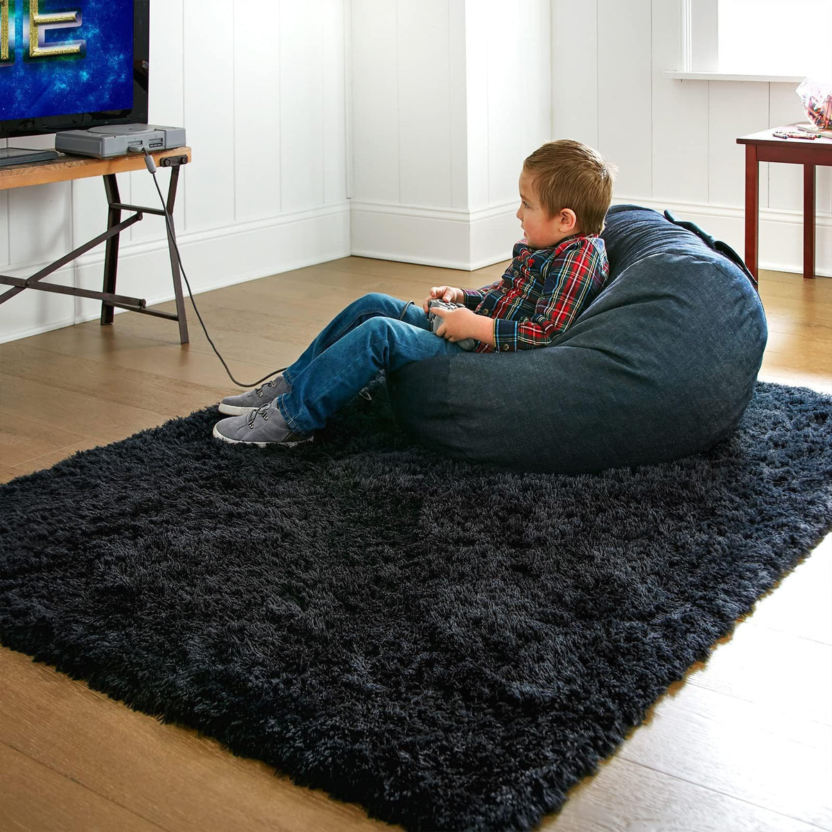 Ophanie baby tummy-time rug provides a plush surface for early exploration.