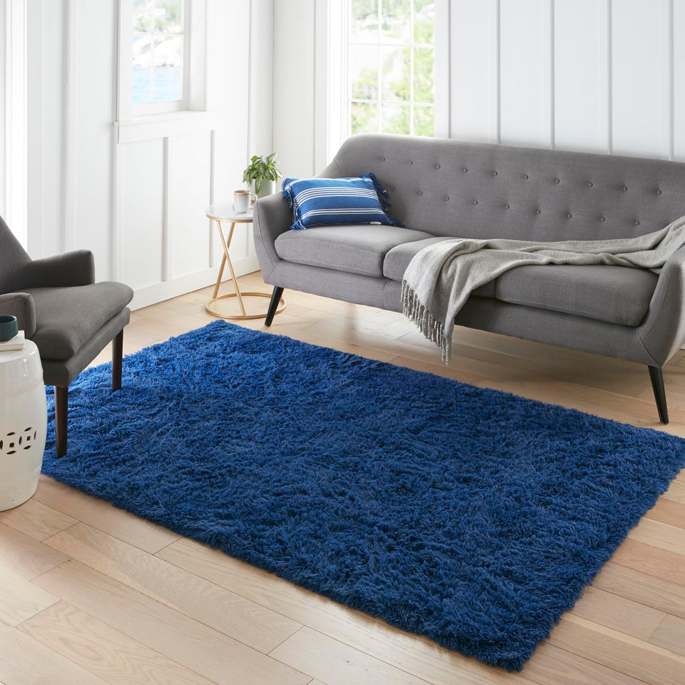 Ophanie Blue Rug in nursery with soft shag for cozy playtime.