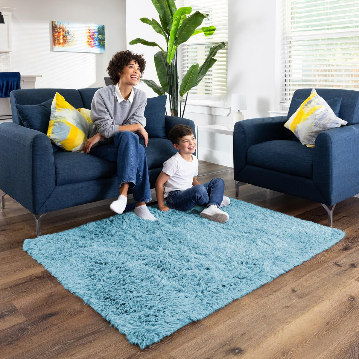 Ophanie light blue rug in nursery supporting tummy time on a soft surface