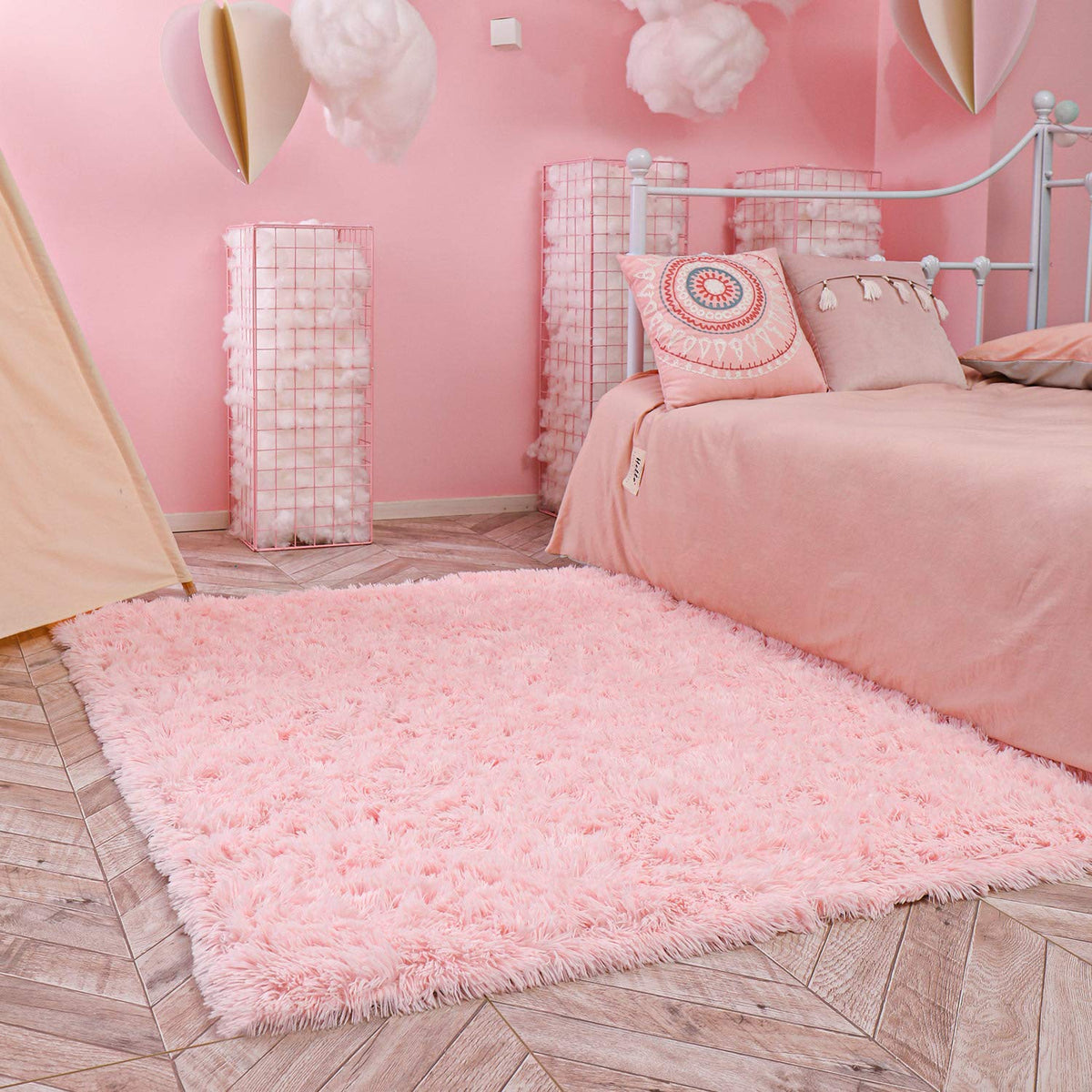 Ophanie pink area rug supports tummy time on a comfy surface