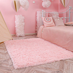 Ophanie pink area rug supports tummy time on a comfy surface