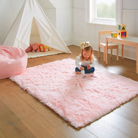 Ophanie Pink Rug for baby's play area supports barefoot comfort and security.
