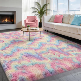 Ophanie Rainbow Rug with fluffy surface for cozy kid-friendly comfort.