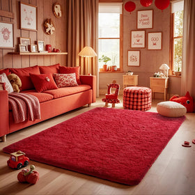Dorm room setup featuring Ophanie red rug for warm decor on a budget