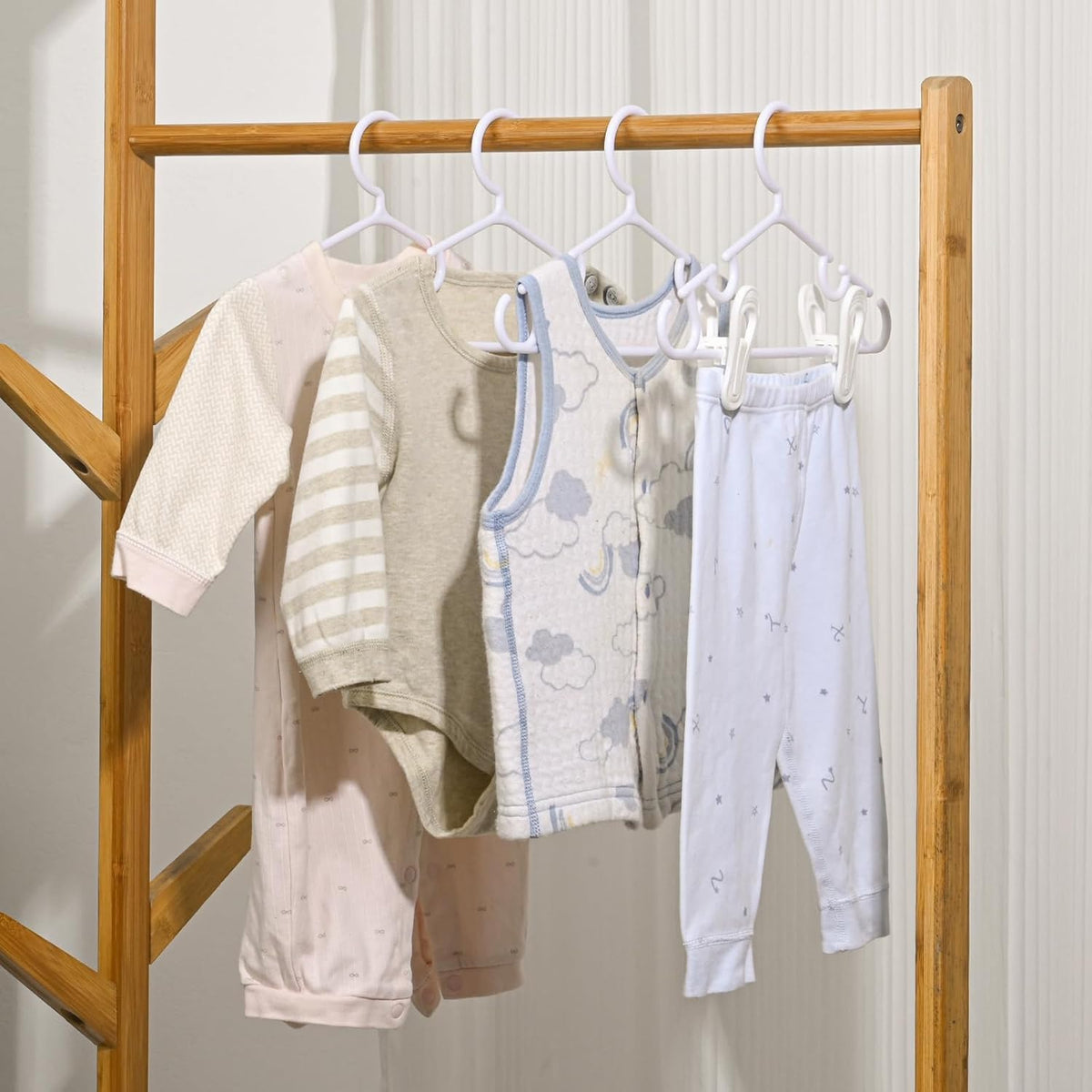 Well-sized Oppeeye hangers designed for baby shirts, pants, and onesies.
