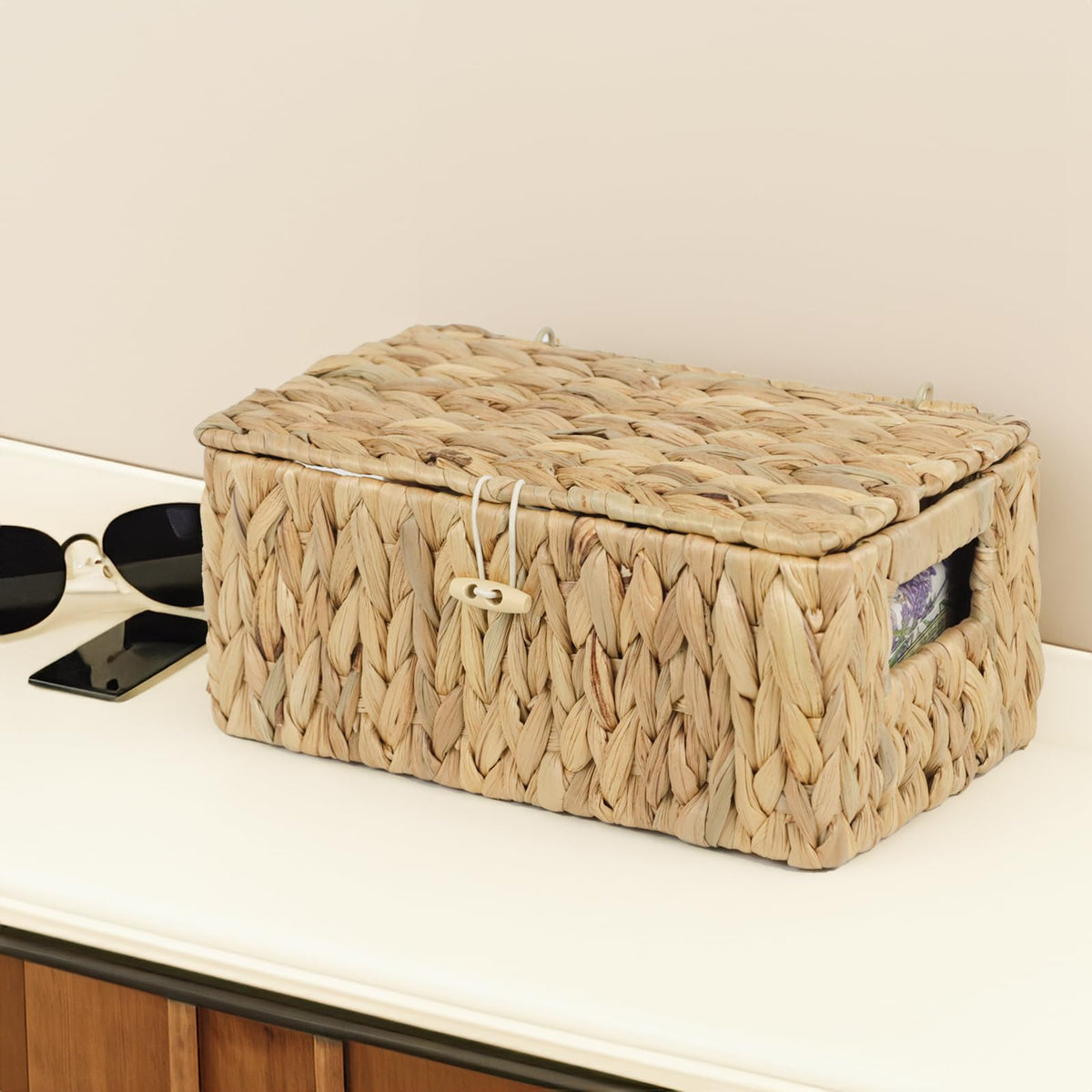 Ordelite basket placed in living room or nursery, adding warmth and organization.