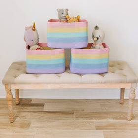 OrganiHaus pastel rainbow baskets holding towels in a bright nursery