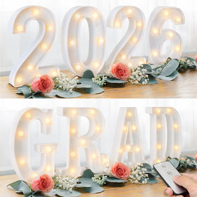 Oriental Cherry Grad 2026 LED letters mounted on wall for bright graduation moments.