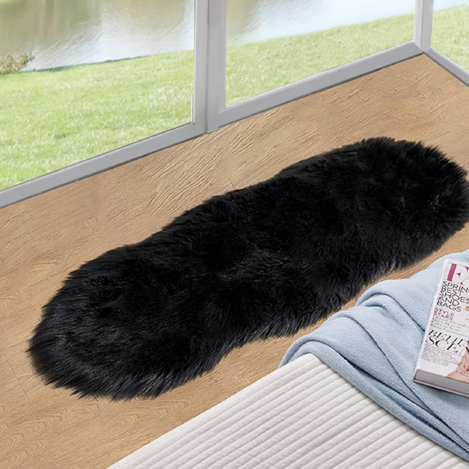 ORINOVA black fluffy faux sheepskin rug 2x4ft close-up reveals ultra-soft plush texture for cozy floors.