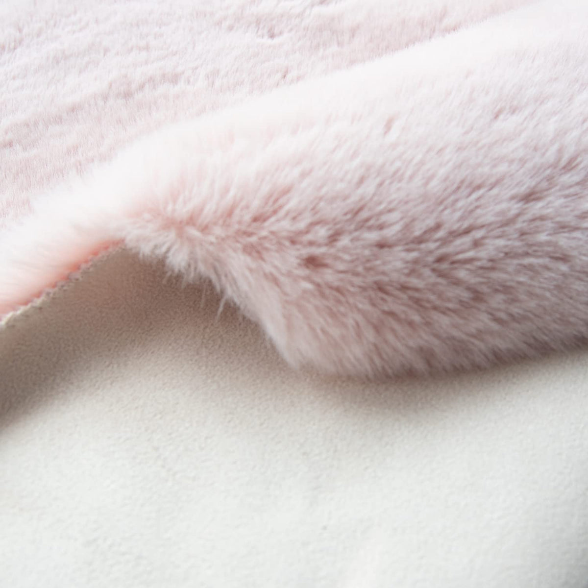 ORINOVA pink fuzzy rug in bedroom offers luxurious underfoot feel