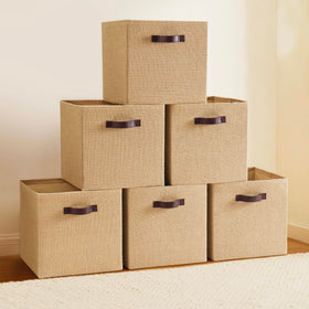 Ornavo Home 13x13 storage bin front view in natural jute with faux leather handles.