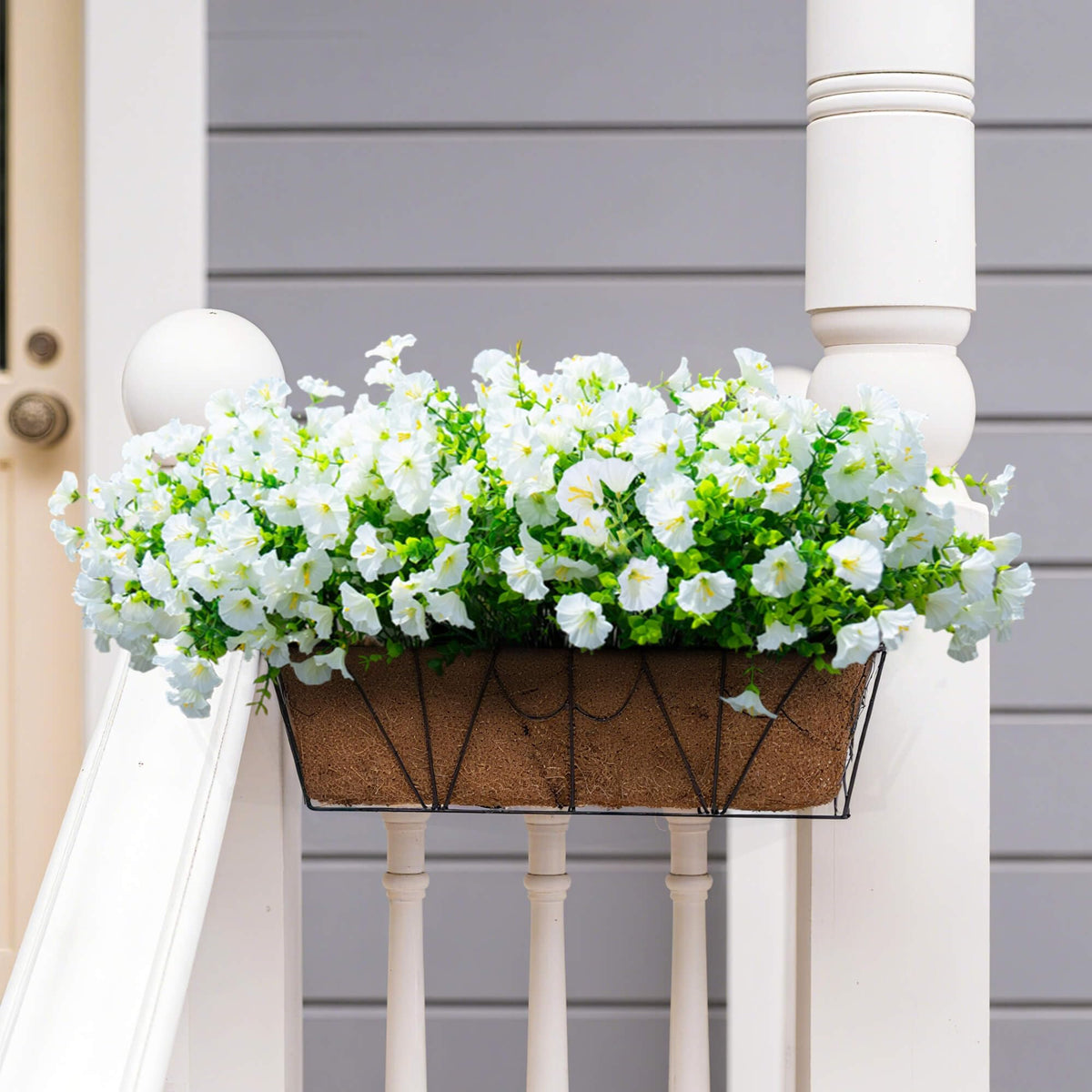 Orphidel window box displays featuring faux flowers for instant fullness.