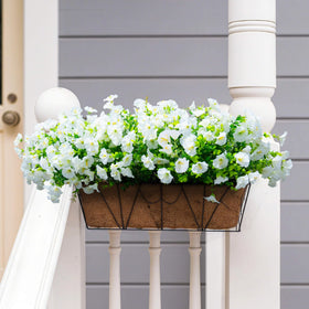 Orphidel window box displays featuring faux flowers for instant fullness.