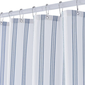 ORTIGIA blue and white striped shower curtain enhances bathroom organization and style.
