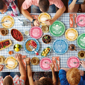 Osonm Fiesta table set-up scene with coordinated plates and napkins.