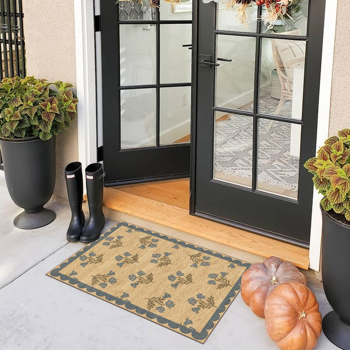 Othilic blue scalloped-edge mat adds coastal farmhouse charm.