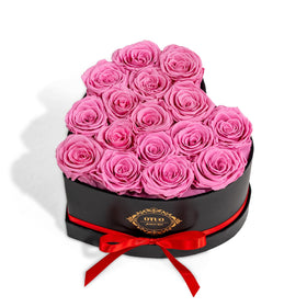 Otuo 16 preserved roses in a pink heart box with lasting beauty for years.