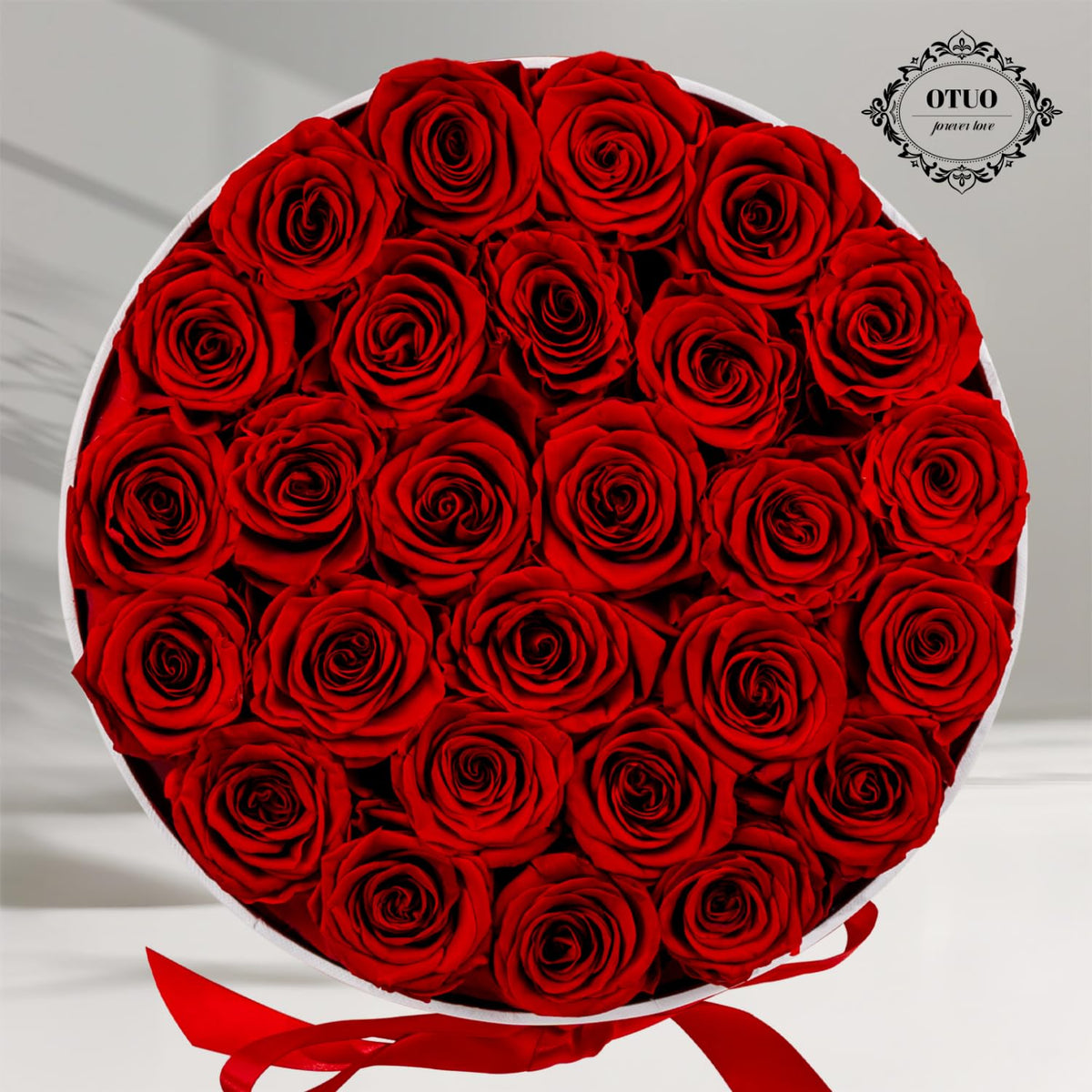 Otuo rose box on coffee table adds lasting decor.