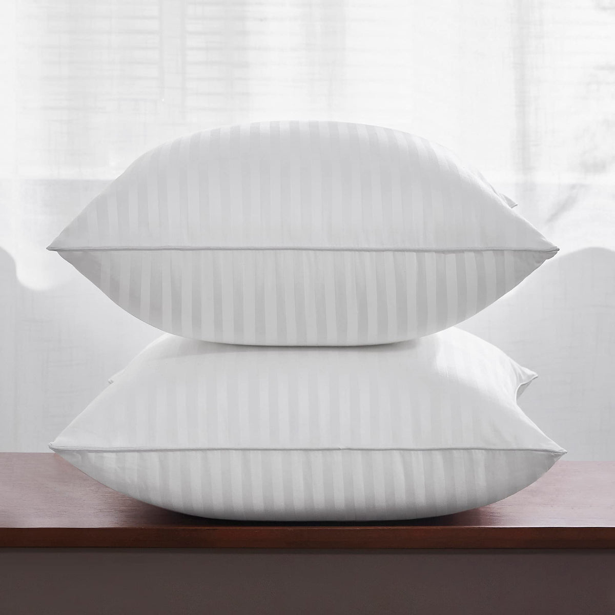 Oubonun 26x26 pillow insert side view highlights resilient shape and supportive feel on a sofa.