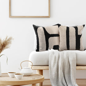Close-up of Oudain tufted texture on 18x18 cover showing soft polyester feel