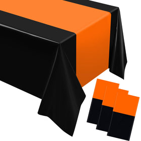 Oudain orange and black disposable tablecloth protects rectangular tables during a festive gathering.