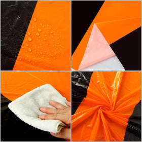 Oudain waterproof rectangle table cover in orange and black after decorations.