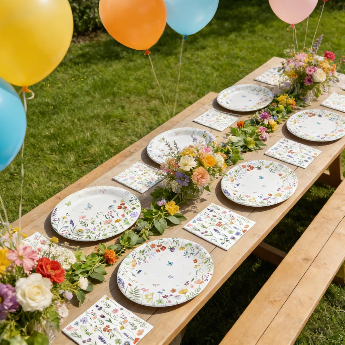 OuMuaMua outdoor party setup with plates and napkins ready