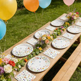OuMuaMua outdoor party setup with plates and napkins ready