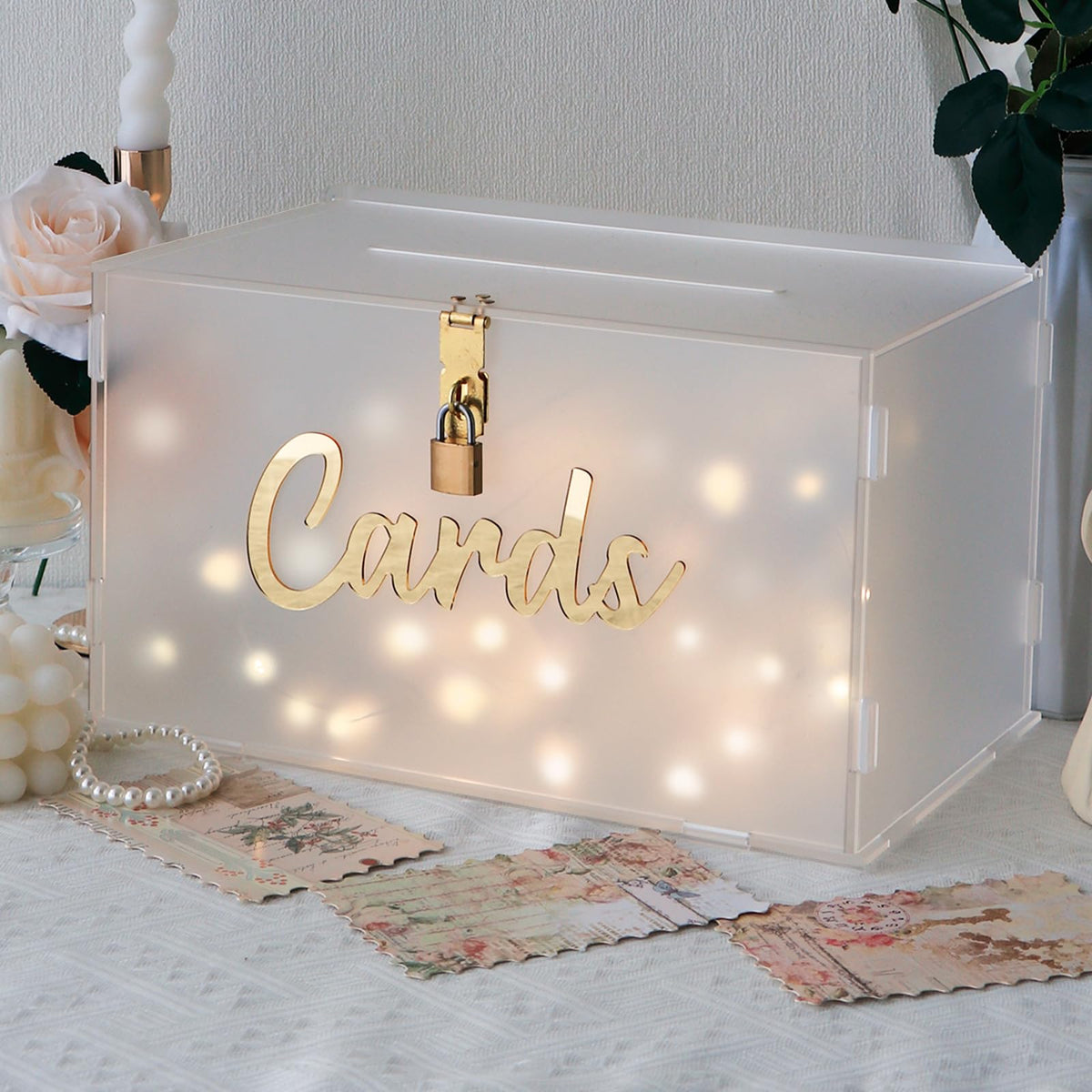 OurWarm frosted acrylic wedding card box with string light creates a romantic reception focal point.