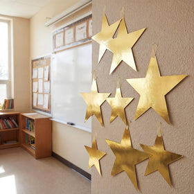 Outus gold star cutouts suitable for birthday party ornaments and photo backdrops.