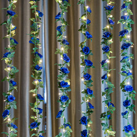 OWPFJG royal blue silk rose vine is ideal for banner-like wall decor and banisters.