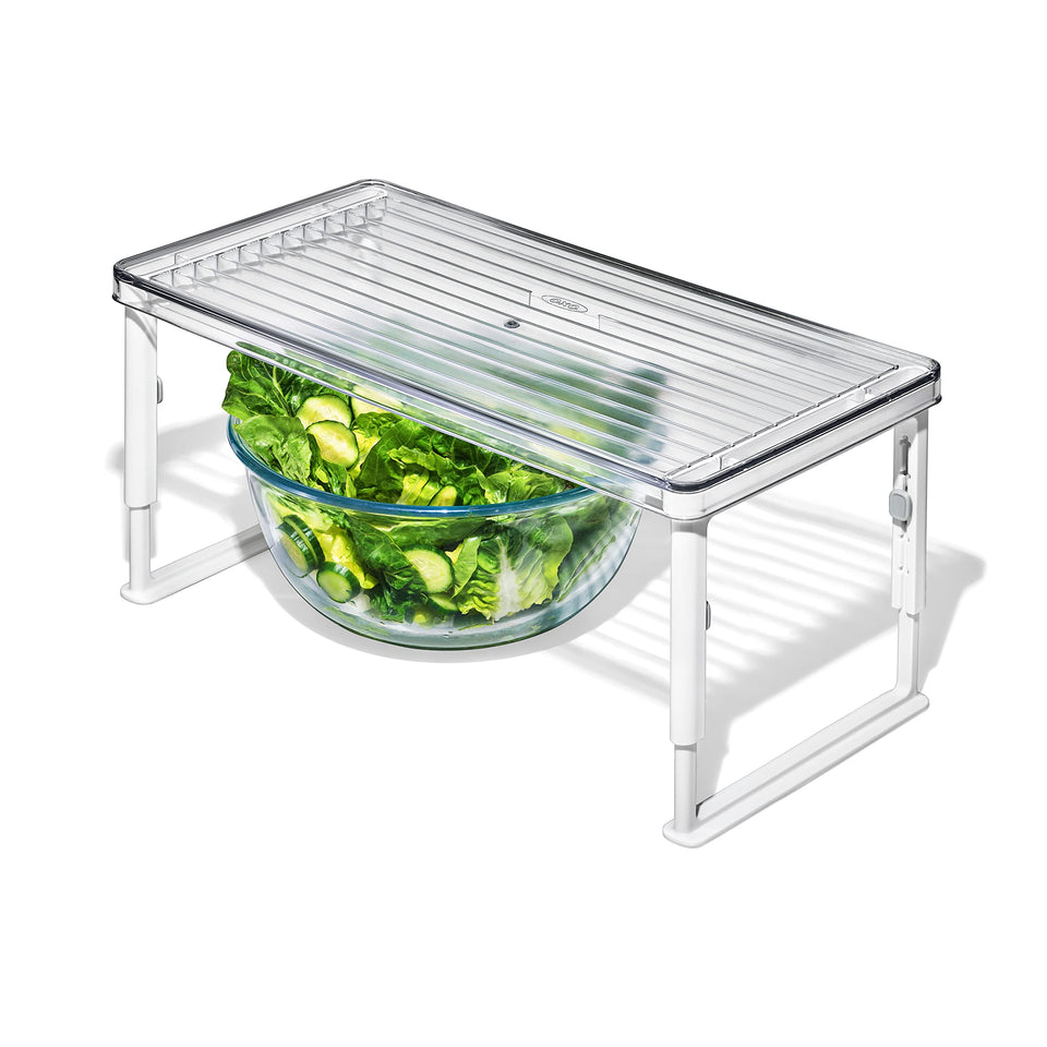 OXO Good Grips Adjustable Fridge Shelf Riser, front view, maximizing vertical space for easy access.