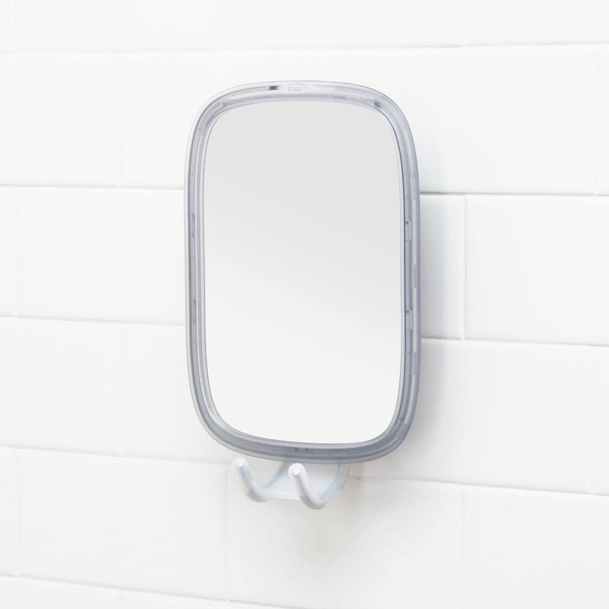 OXO Good Grips fogless mirror with razor hooks offers organized grooming.