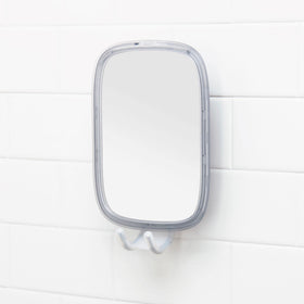 OXO Good Grips fogless mirror with razor hooks offers organized grooming.