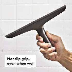 OXO Good Grips squeegee tilted on glass for efficient water removal
