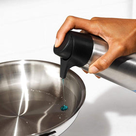 Brushed stainless steel body of the OXO dispenser with non-slip foot