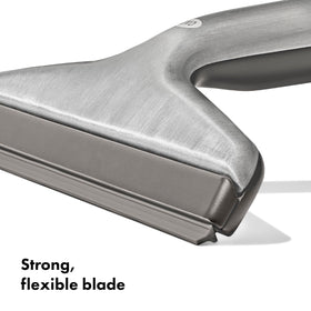 OXO Good Grips stainless steel squeegee blade close-up—flexible edge adapts to contours
