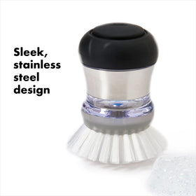 Durable nylon bristles close-up scrub baked-on residue from non-stick cookware.