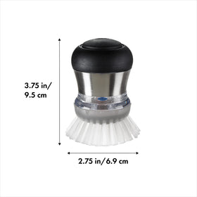 OXO Soap Dispensing Palm Brush in action shows convenient one-button delivery.