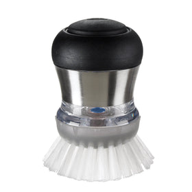 OXO Steel Soap Dispensing Palm Brush front view demonstrates easy soap release.