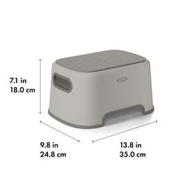 OXO Tot Step Stool Drizzle in-use shows easy carrying with soft handles.