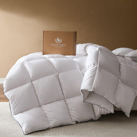 Pacific Coast goose-down comforter folded on bed for instant luxury and coziness