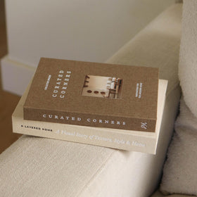 Paige McRae shelf decor neutral arrangement complements modern and vintage styles